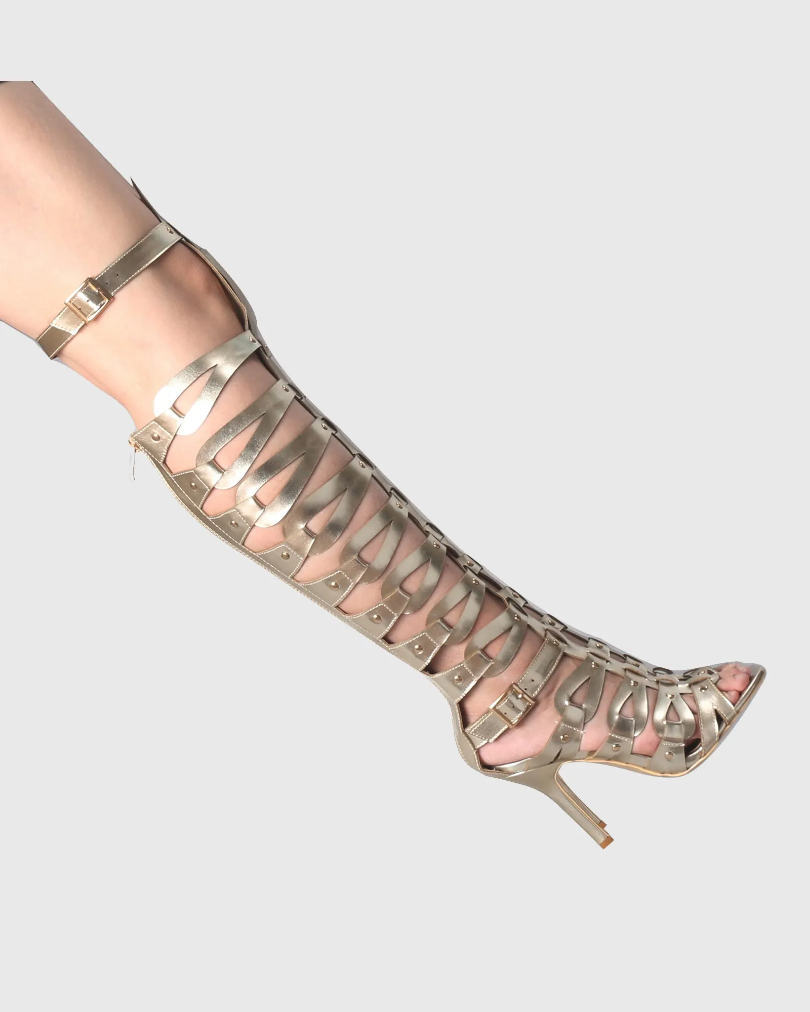 Gessica Rivet Cutout Knee High Boots In Gold